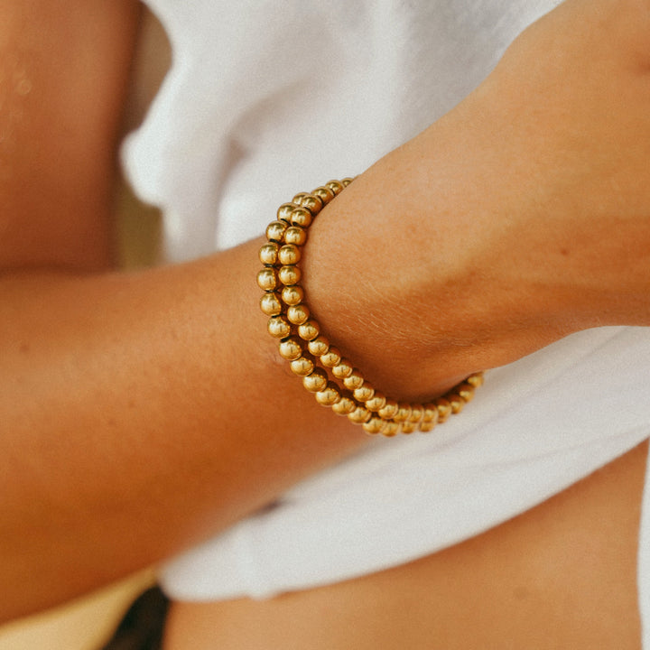 Title: Bracelet de perles dorées Caicos