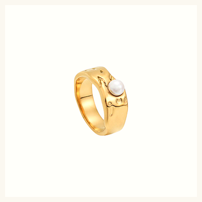 Bague dorée perle et lignes ondulées